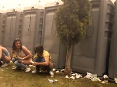 Girls pissing outdoor at Festival